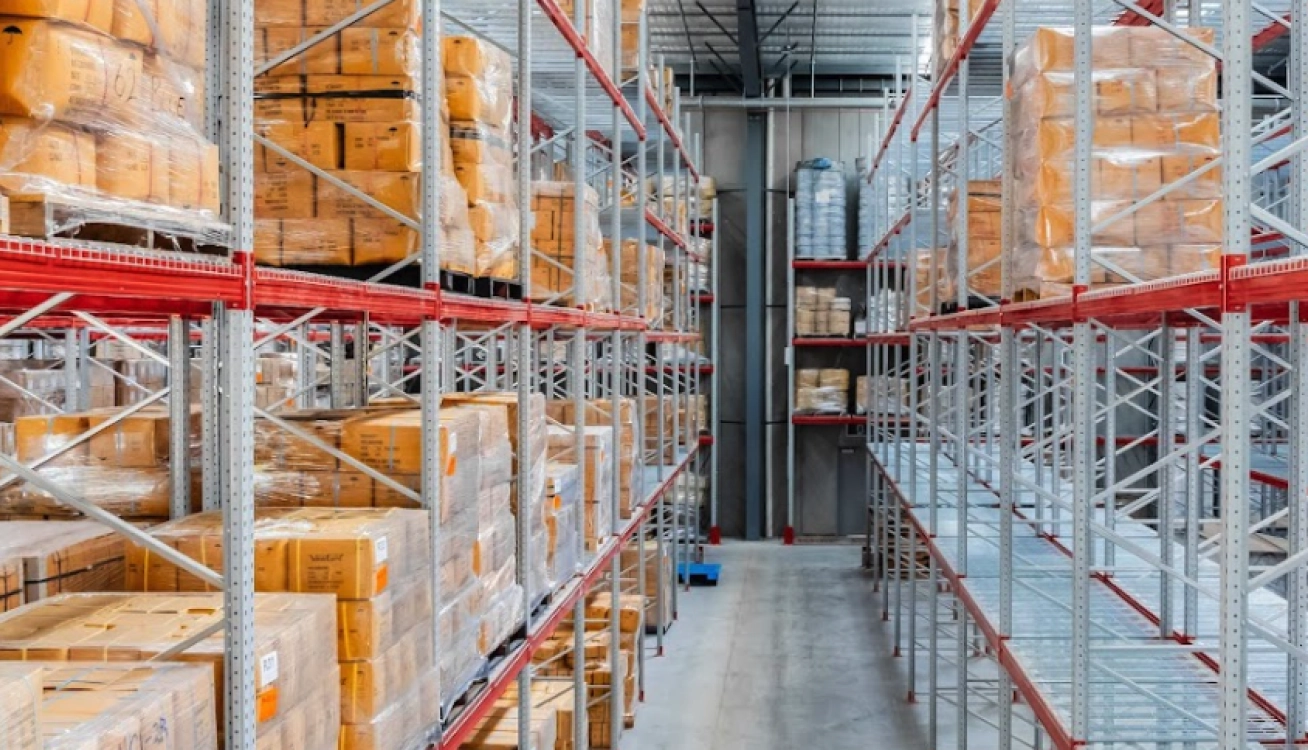 Warehouse pallet racking system with boxed inventory and organised bulk storage layout